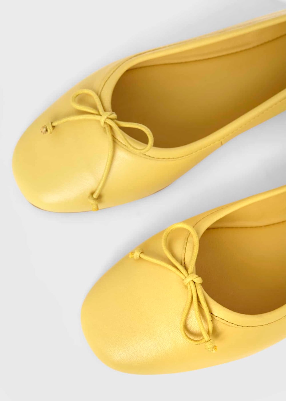 Pale yellow flats 2025