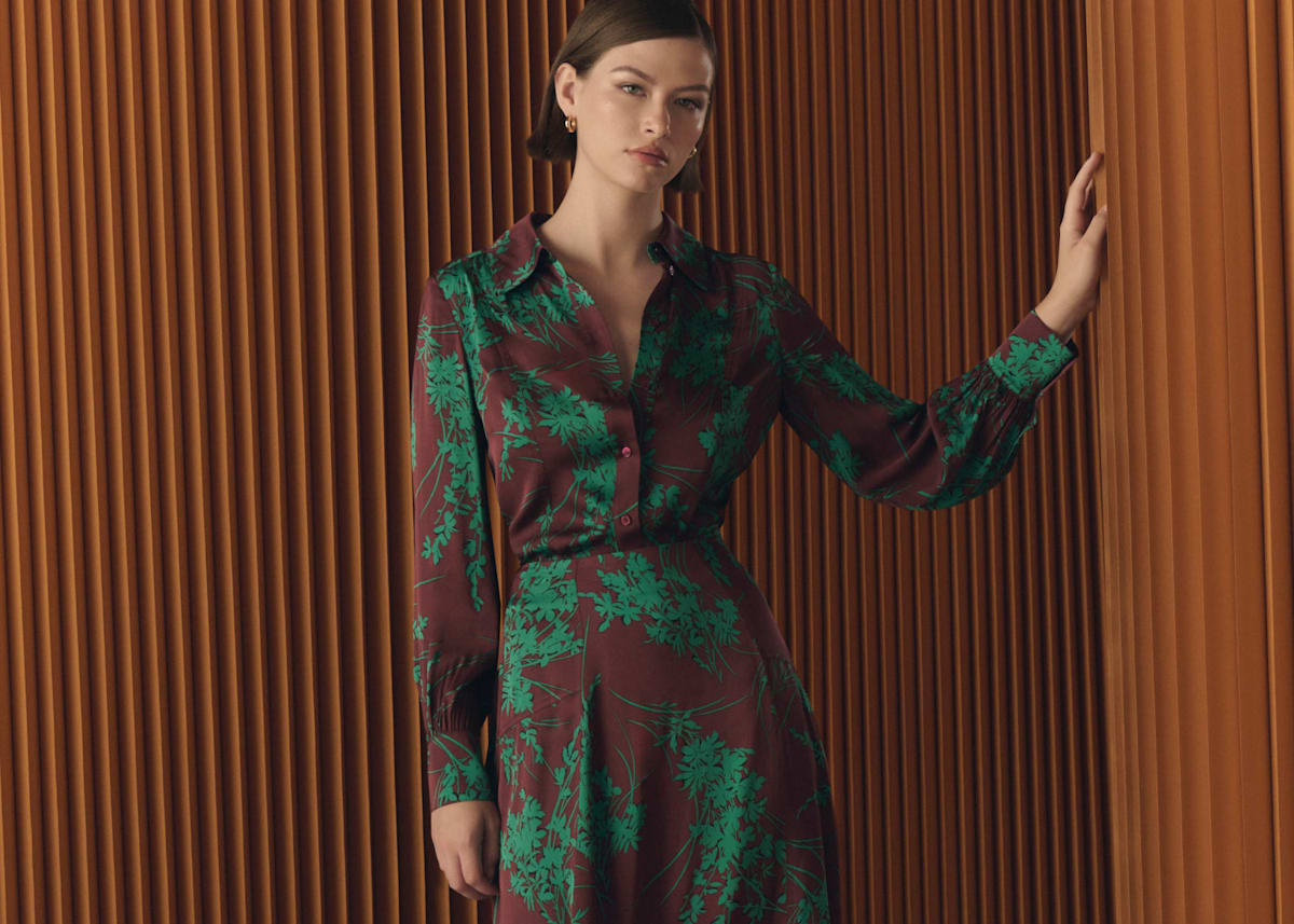 Model photographed in a brown and green co-ord set.