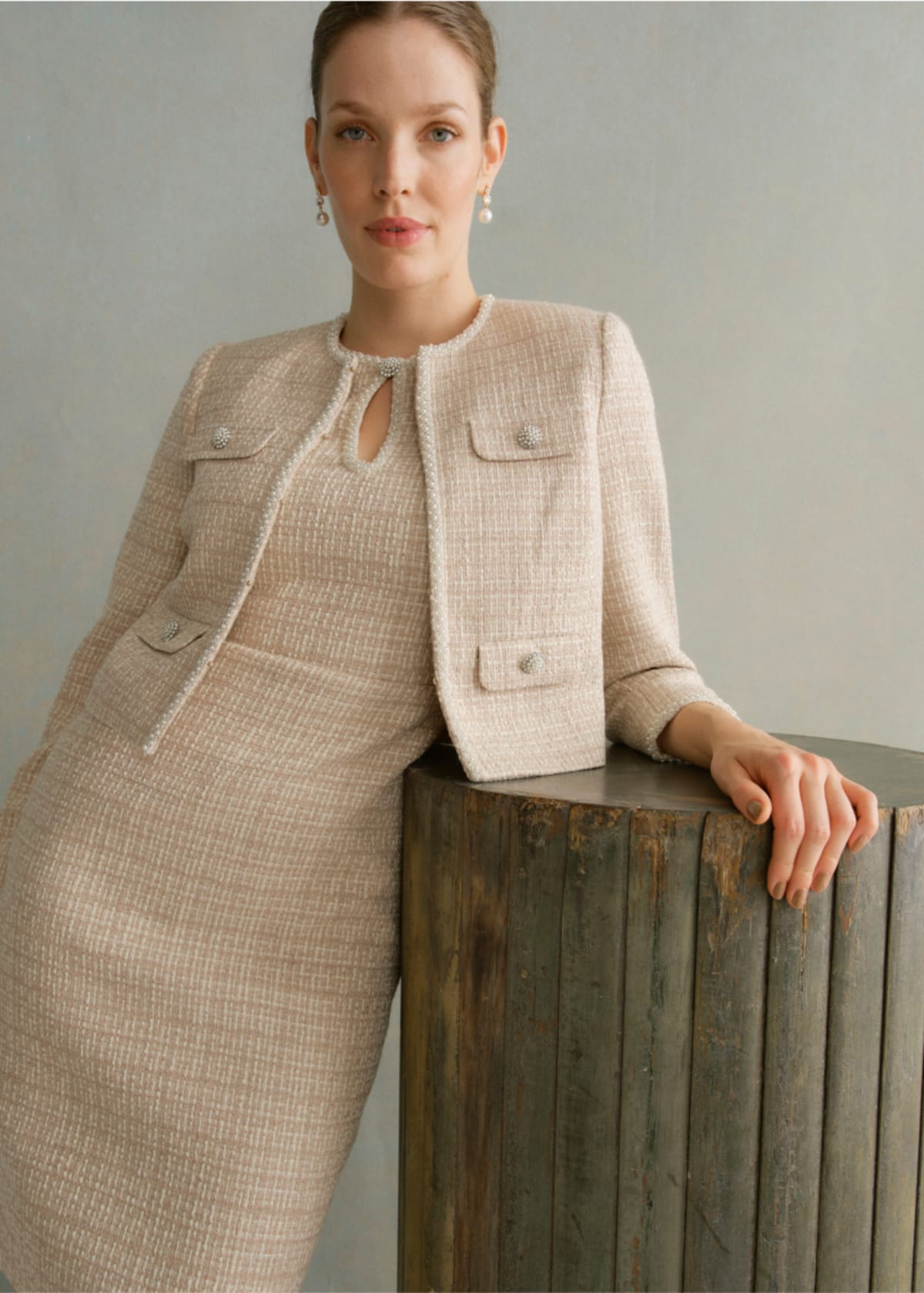 A gallery of two images of models wearing occasion coords in neutral colours.