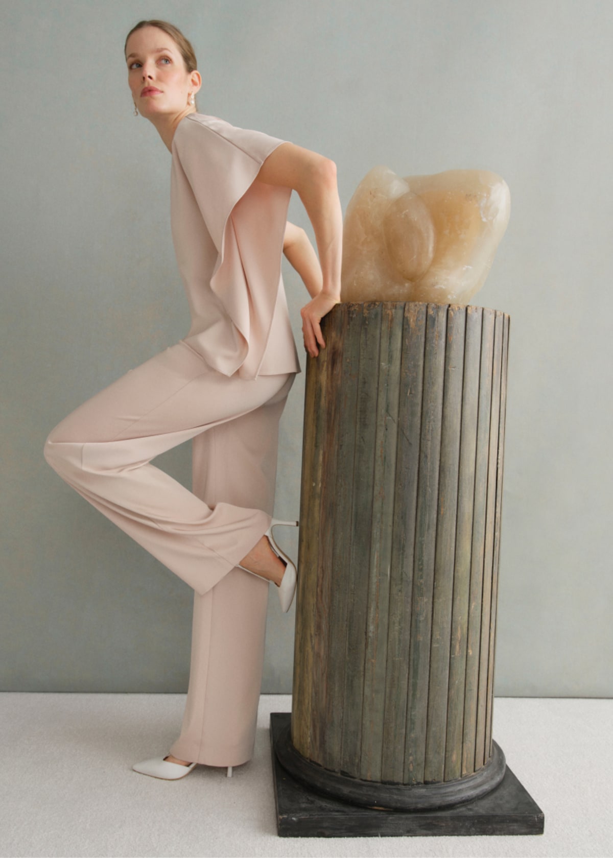 A gallery of two images of models wearing occasion coords in neutral colours.