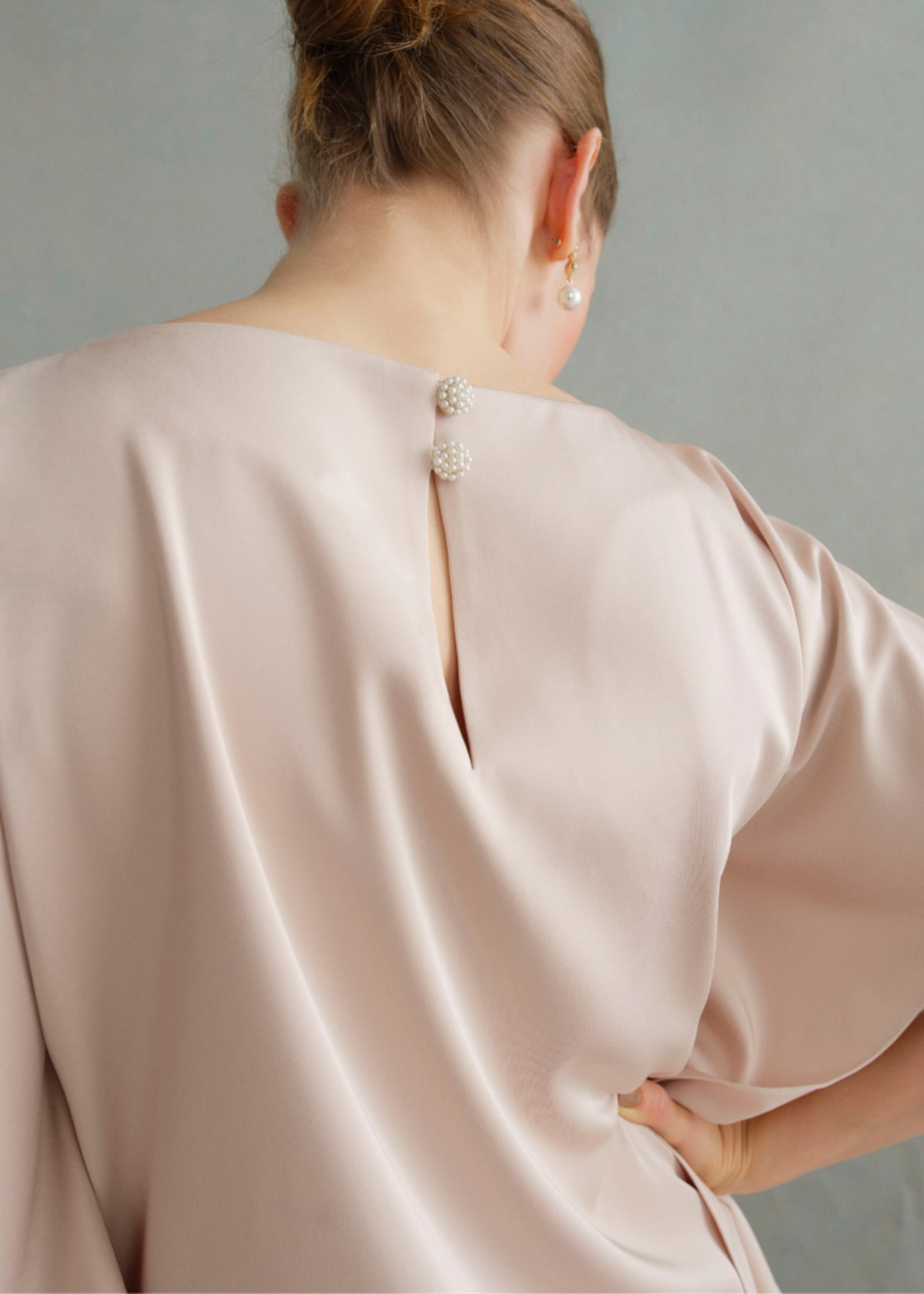 A gallery of two images of models wearing occasion coords in neutral colours.
